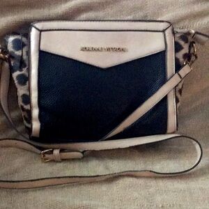 Used black and cream  designer  with leopard print.Lots of life left.